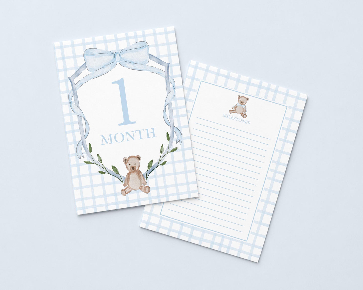 a baby milestone card with a teddy bear and the number "1 Month" printed on it.