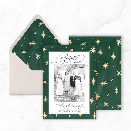 A green Christmas card with gold stars and a photo of four people, along with an envelope and a photo of the card.