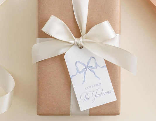 A gift wrapped in brown paper with a white ribbon and a tag that reads "A Gift from The Jacksons".