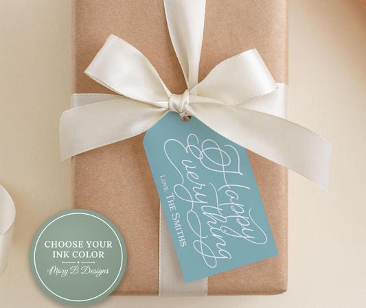 A brown gift box with a white ribbon and a blue tag that reads "Happy Everything Love The Smiths".