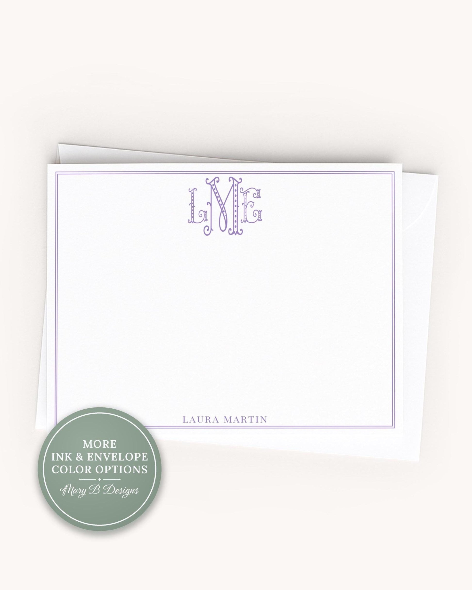 A blank white card with a personalized monogram and the name 'LURA MARTIN' printed on it.