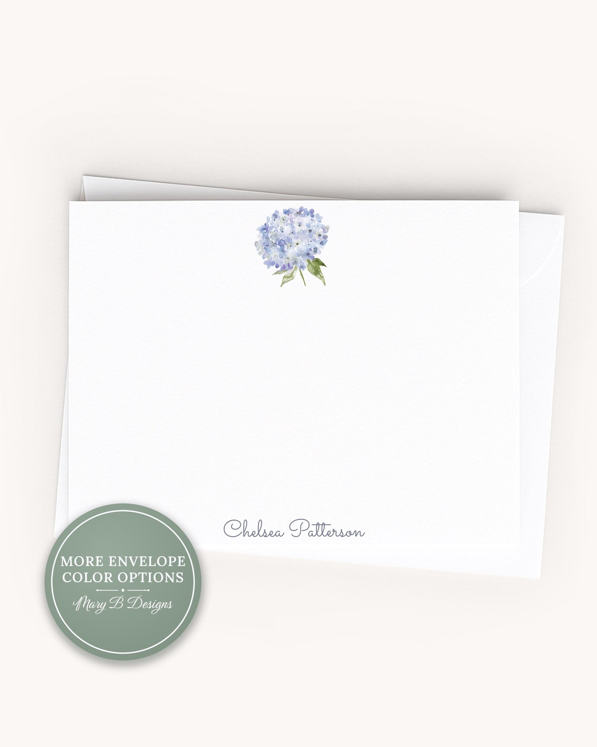 A white card with a blue flower design and the name "Chelsea Pittenson" printed on it.