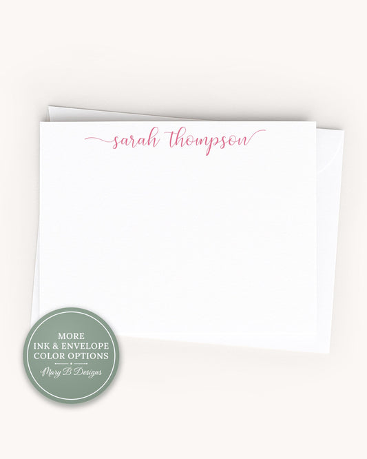 A white card with the name 'Sarah Thompson' written on it in cursive script.