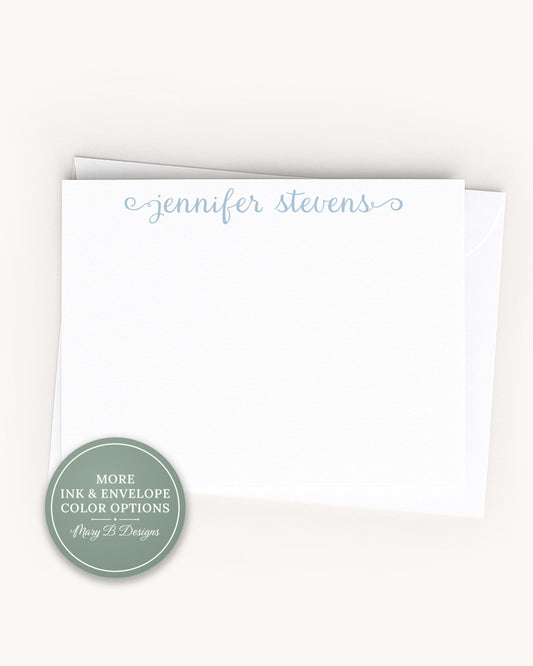 A blank white card with the name 'Jennifer Stevens' written on it.
