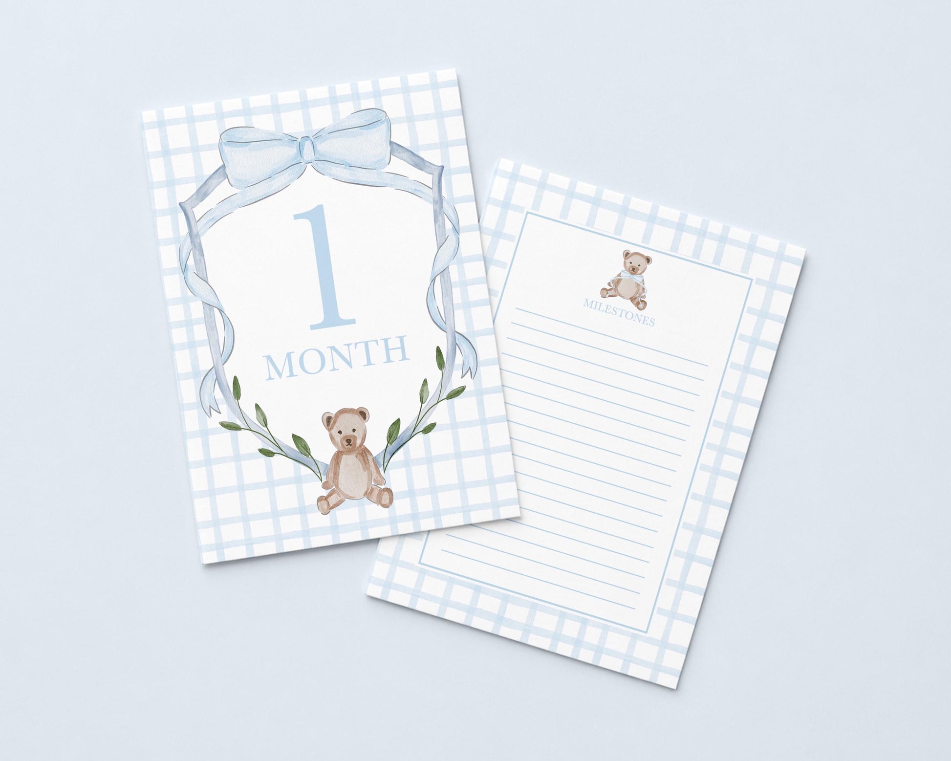 a baby milestone card with a teddy bear and the number "1 Month" printed on it.
