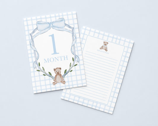 a baby milestone card with a teddy bear and the number "1 Month" printed on it.
