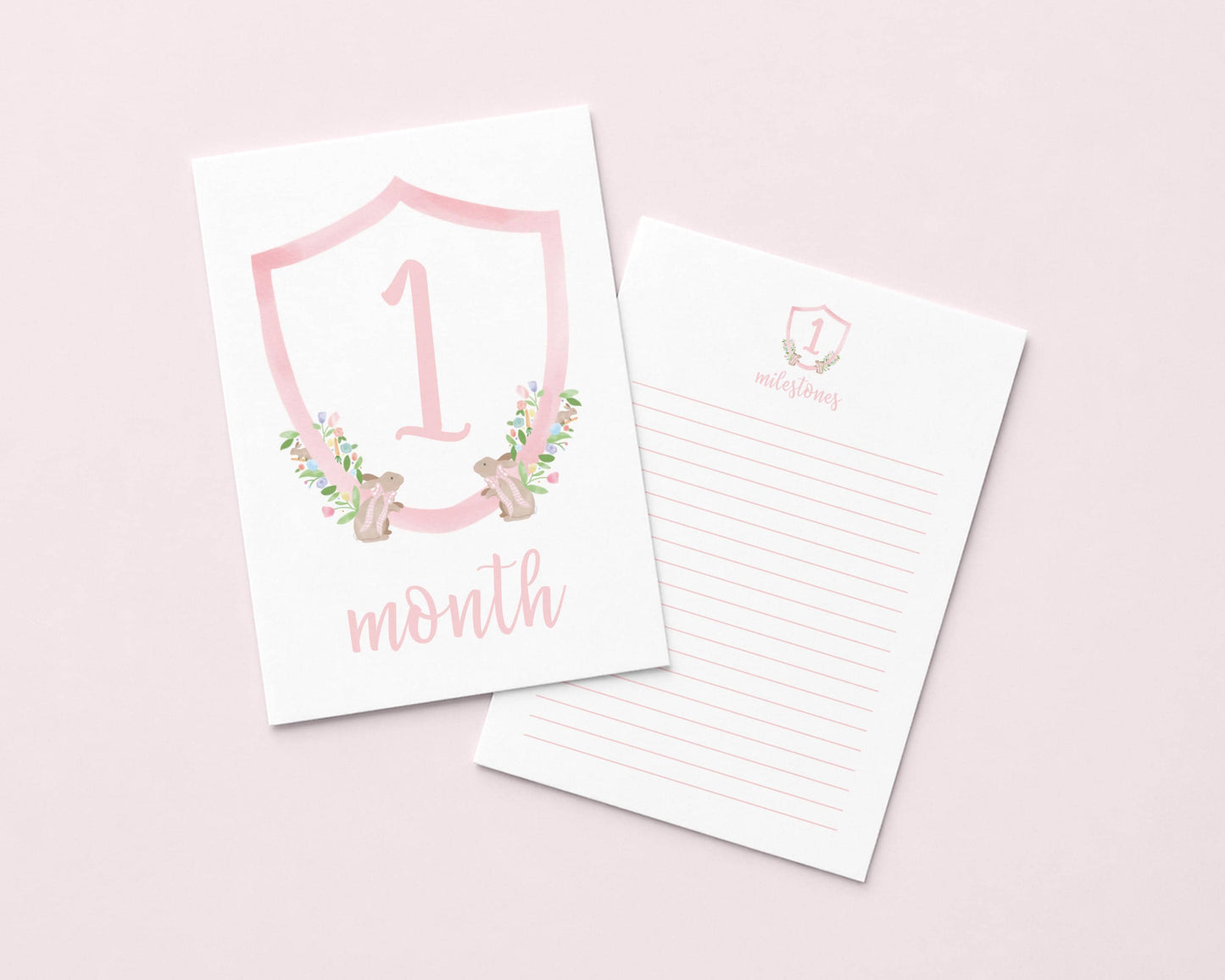 a pink shield-shaped card with the number "1" and the text "month" on it, along with a lined paper pad below it.