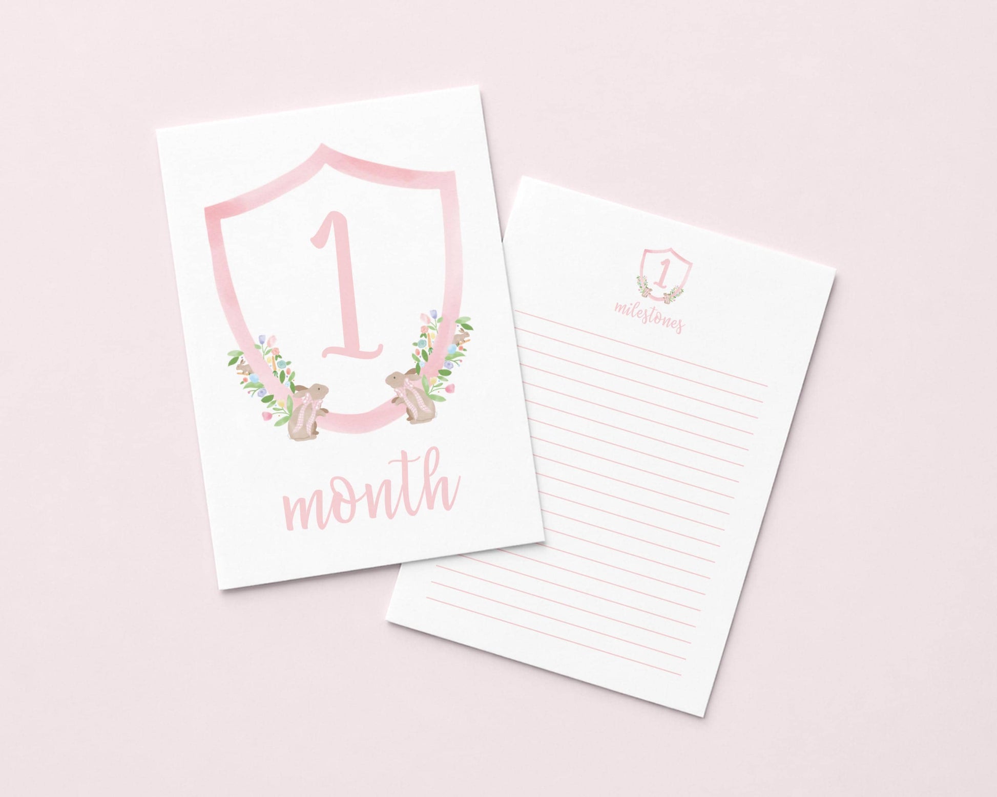 a pink shield-shaped card with the number "1" and the text "month" on it, along with a lined paper pad below it.