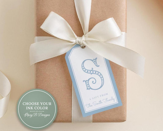 A gift wrapped in brown paper with a white ribbon and a blue tag that reads "A Gift from The Smith Family".