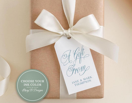 A gift wrapped in brown paper with a white ribbon and a tag that reads "A Gift From Jane & Mark Thompson".