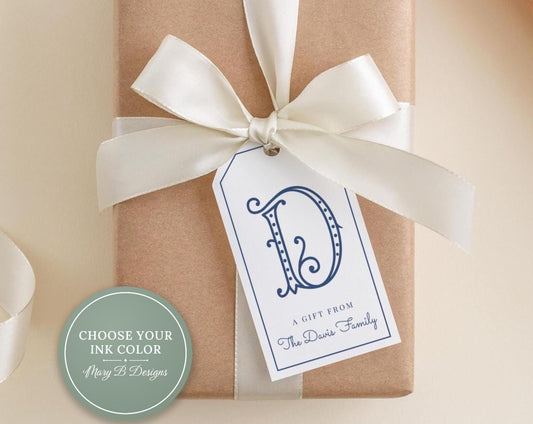 A gift wrapped in brown paper with a white ribbon and a tag featuring a blue letter "D" and text that reads "A Gift from The Davis Family".