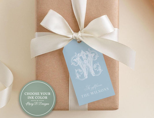 A light brown gift box with a white ribbon and a blue tag that reads "A gift from THE WILSONS".