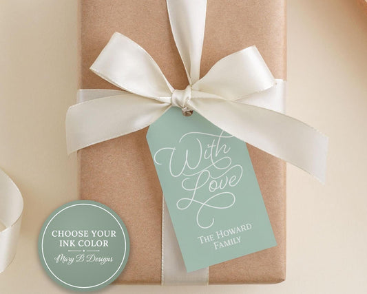 A gift box with a white ribbon and a tag that reads "With Love The Howard Family".