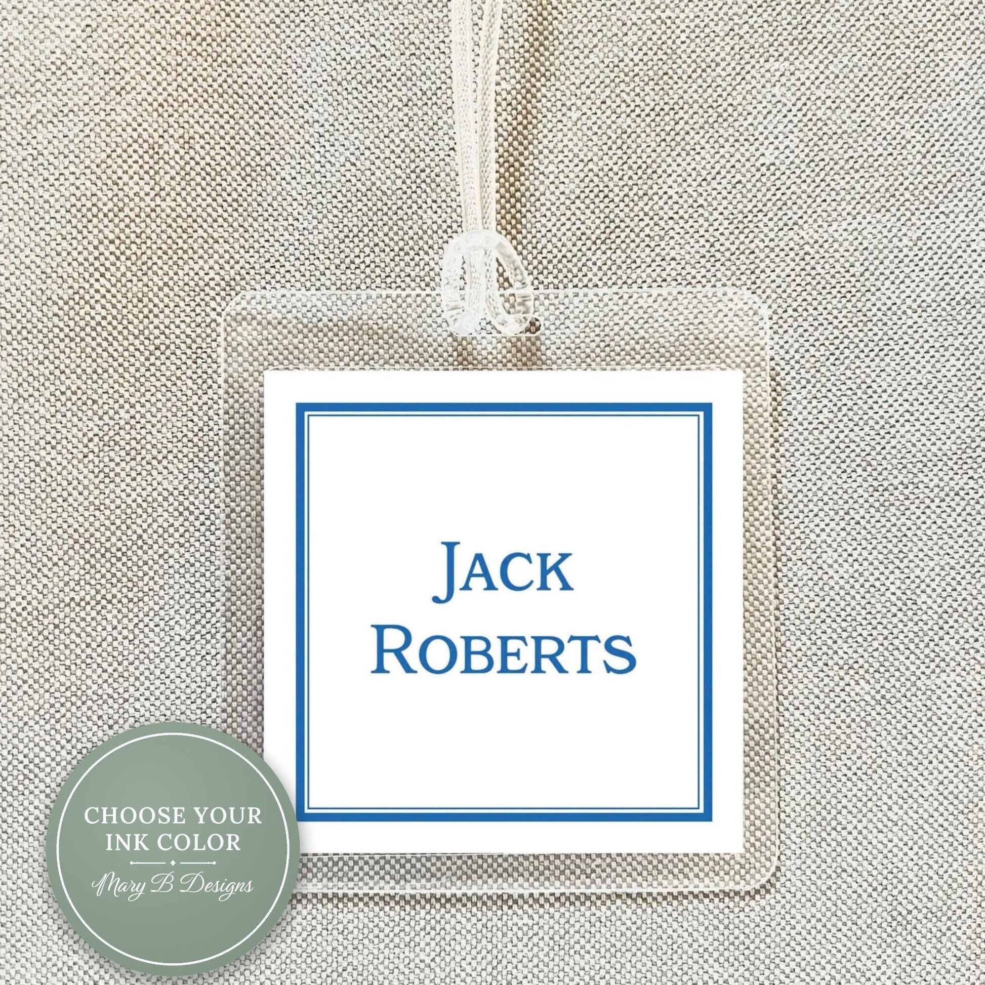 A clear plastic name tag with a blue border, displaying the name "Jack Roberts" in white text.