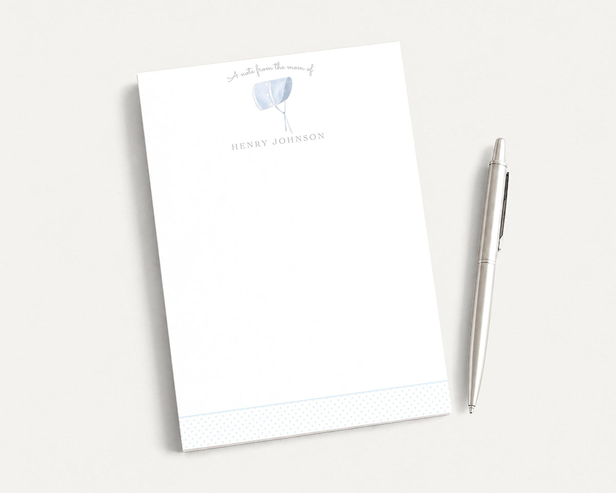 A white notepad with a pen on a white surface. __etsy:8254385293